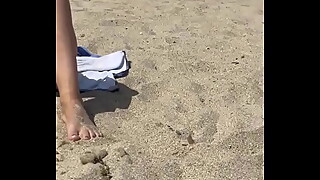 Wife exposes Pussy beneath panties on a public beach